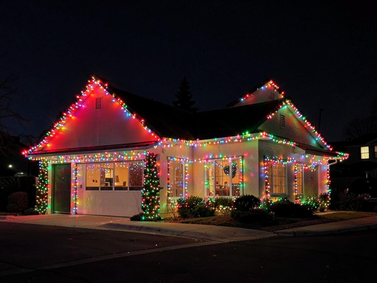 Home outlined with colorful permanent holiday LED lights